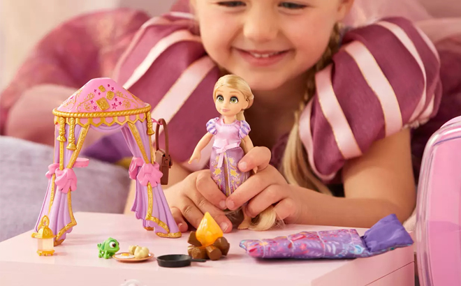 A Person playing with Rapunzel Disney Once Upon a Story Mini Doll Playset