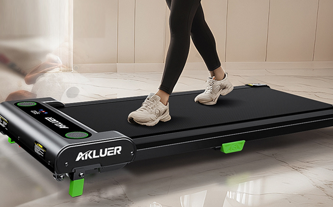 A Person walking on an Akluer Walking Pad Treadmill