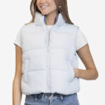 A Person wearing a Madden Girl Reversible Puffer Vest