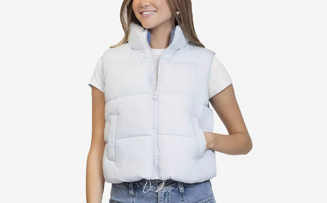 A Person wearing a Madden Girl Reversible Puffer Vest