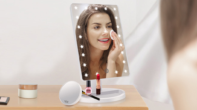 A Woman Doing Her Makeup on the Cosmirror Lighted Makeup Vanity Mirror