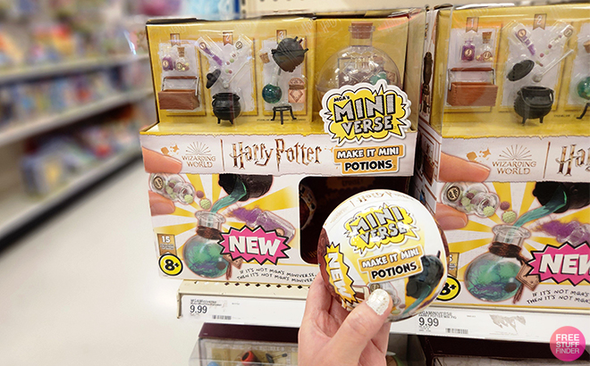 A Woman Holding MGA's Miniverse Harry Potter Make It Mini Potions Capsuel