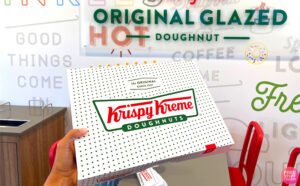 A Woman Holding a Box of Krispy Kreme Dozen Doughnuts