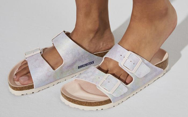 A Woman Wearing Birkenstock Arizona Sandals in Iridescent Rose