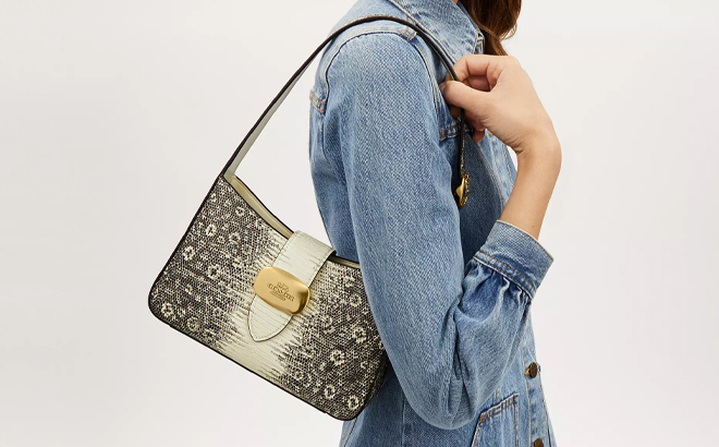 A Woman Wearing Coach Outlet Eliza Shoulder Bag