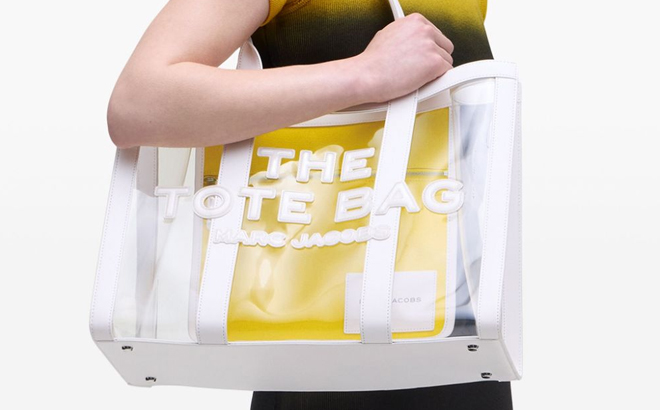 A Woman Wearing Marc Jacobs The Clear Large Tote Bag