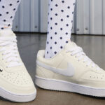 A Woman Wearing Nike Court Vision Low Sneakers