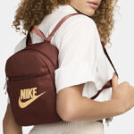 A Woman Wearing Nike Sportswear Futura 365 Mini Backpack