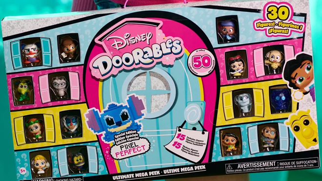 A child carrying a Disney Doorables Ultimate Mega Peek