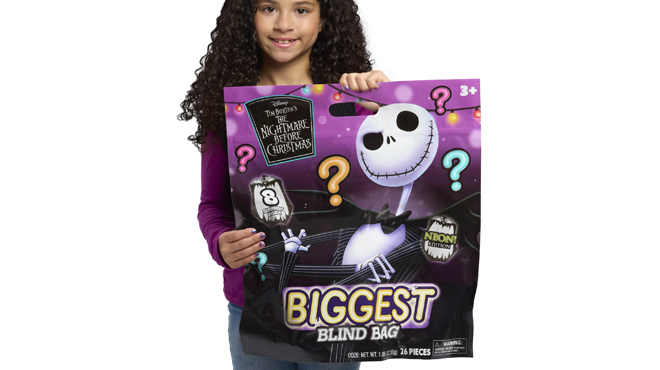 A child holding a Disney Tim Burtons The Nightmare Before Christmas Biggest Blind Bag