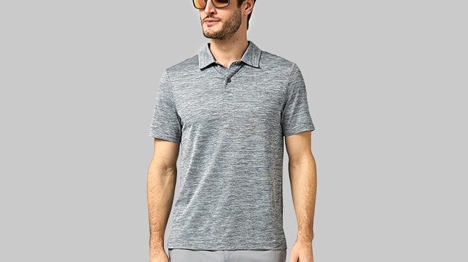 A man wearing a 32 Degrees Mens Ultra Sonic Polo in Charcoal SPace Dye