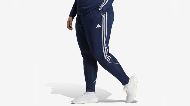 A person wearing a Adidas Tiro Trackpants Plus Size