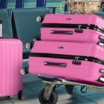 A pink Zimtown 3 Piece Spinner Suitcase