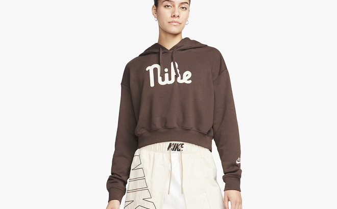 A woman wearing a Nike Womens Oversized Cropped Hoodie