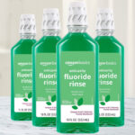 Amazon Basics Anticavity Fluoride Rinse 4 Pack on a Table