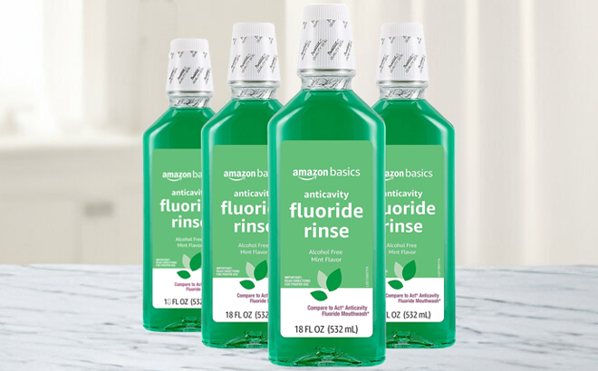 Amazon Basics Anticavity Fluoride Rinse 4 Pack on a Table