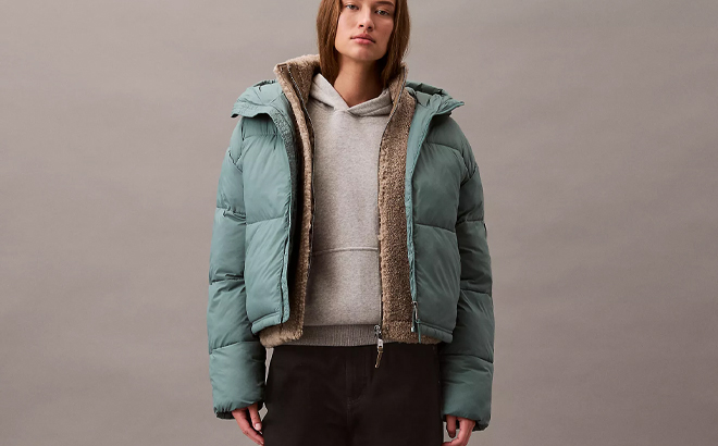 Calvin Klein Short Hooded Puffer Jacket in the Color North Atlantic