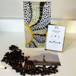 Coffee Bag Postcard and Coffee Beans on a Tabletop