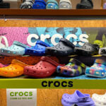 Crocs Clogs in Various Colors on a Shelf