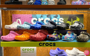 Crocs Clogs in Various Colors on a Shelf