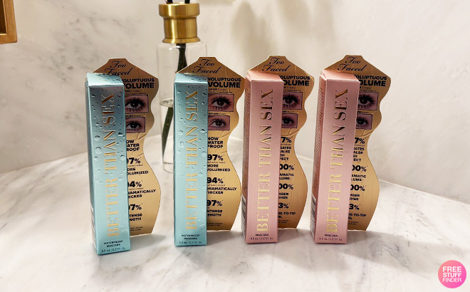 Four Too Faced Mascaras on a Marble Countertop