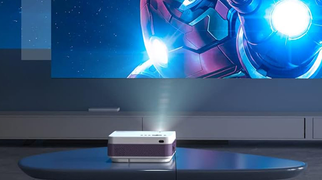 Fudoni Mini Bluetooth Projector with WiFi on a Table in a Room