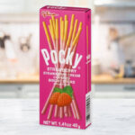 Glico Pocky Strawberry Cream Covered Biscuit Sticks on a Table