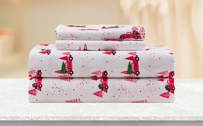 Joyland Red Truck Printed Sheet Set on a Table