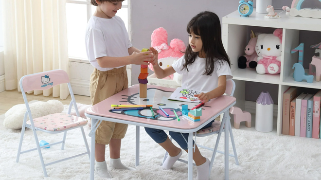 Kids Playing on a Hello Kitty Kids 3 Piece Table and Chairs Set