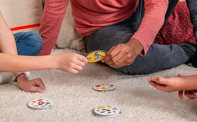 People Playing Spot It Classic Card Game