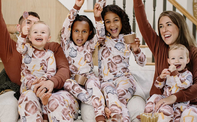 People wearing Burts Bees Baby Football Season Matching Family Pajamas