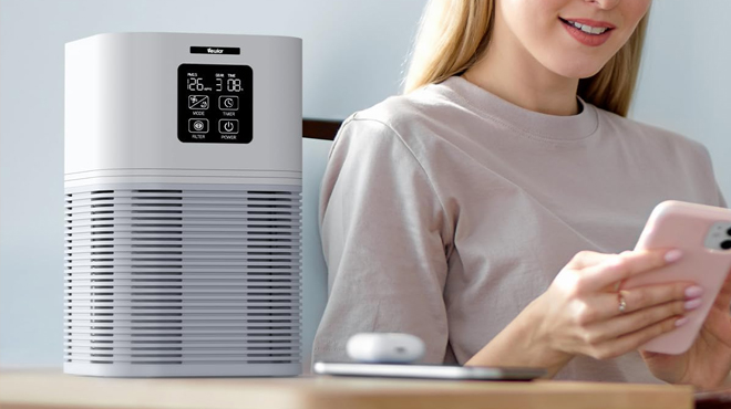 Person Sitting Next to Air Purifier