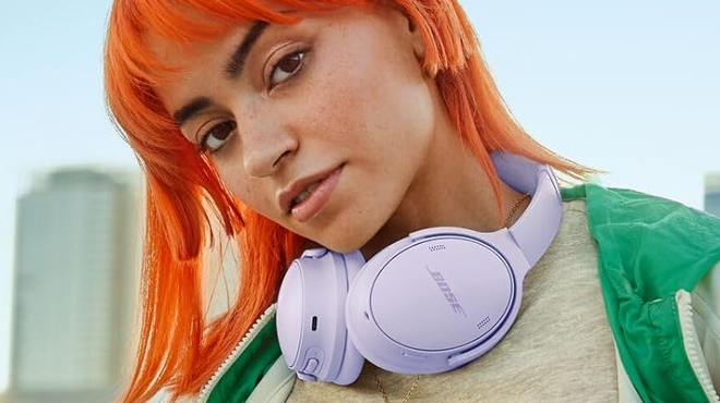 Person Wearing Lilac Bose Headphones