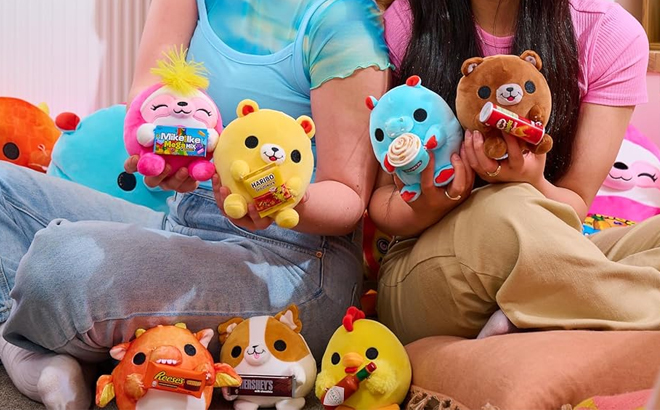 Two Girls Holding the Zuru Snackles Mystery Plushies