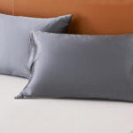 Two Pillows with Netcken Satin Pillowcases in Dark Grey Color