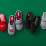 Various Styles of Dearfoams Slippers on a Green Background