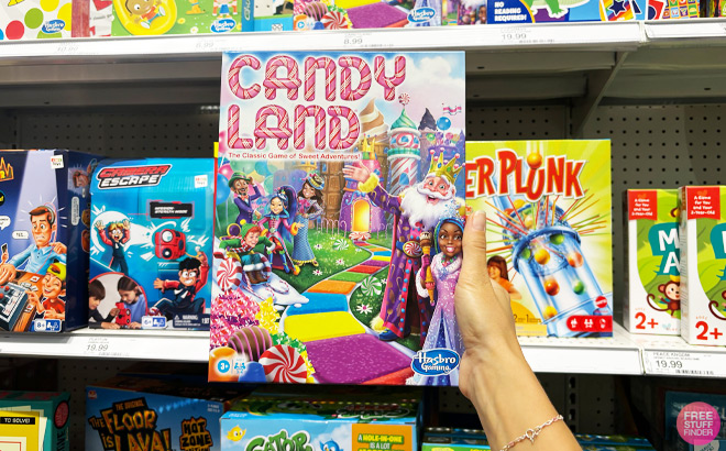 a Person Holding Hasbro Candyland Board Game