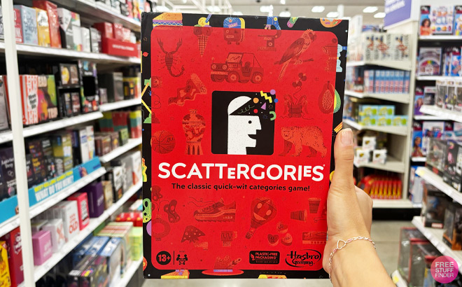 a Person Holding Hasbro Scattergories Game