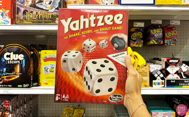 a Person Holding Hasbro Yahtzee Classic Game