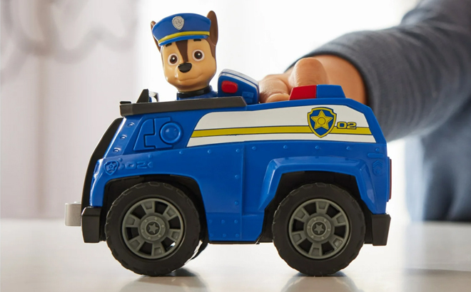 A Boy Playing with the Paw Patrol Chase's Patrol Cruiser with Figure