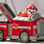 A Boy Playing with the Paw Patrol Marshall's Firetruck with Figure