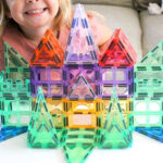 A Child Playing with Magnetic Tiles