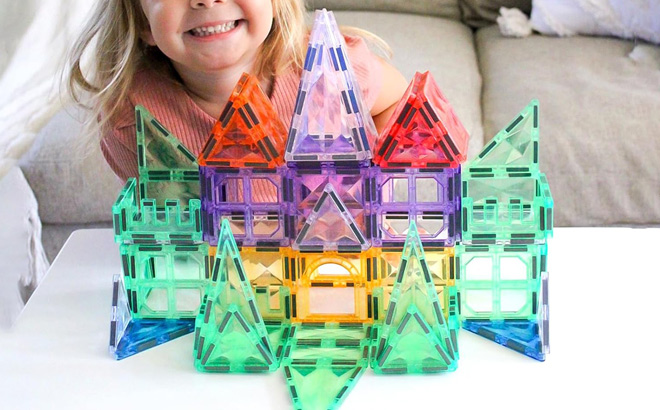 A Child Playing with Magnetic Tiles