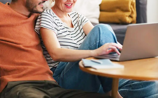 A Couple Using a Laptop to Manage Their Savings