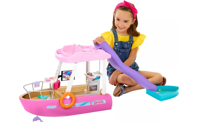 A Girl Playing with Barbie Dream Boat Playset