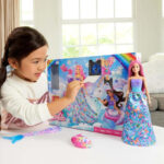 A Girl Playing with the Barbie Advent Calendar