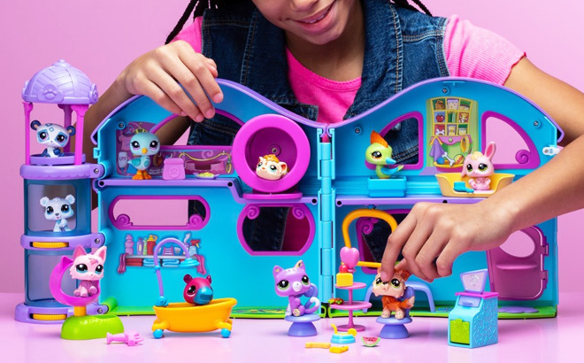 A Girl Playing with the Littlest Pet Shop Deluxe Playset