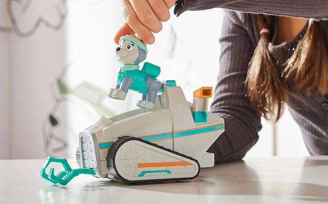 A Girl Playing with the Paw Patrol Everest’s Snow Plow Play Vehicle