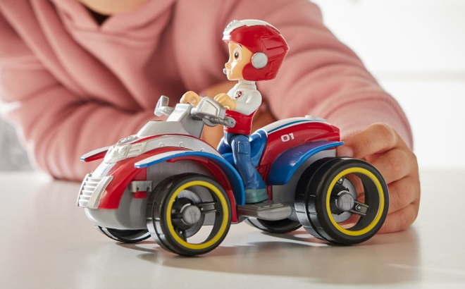 A Girl Playing with the Paw Patrol Ryders ATV Vehicle and Figure