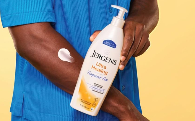 A Hand holding Jergens Ultra Healing Dry Skin Lotion